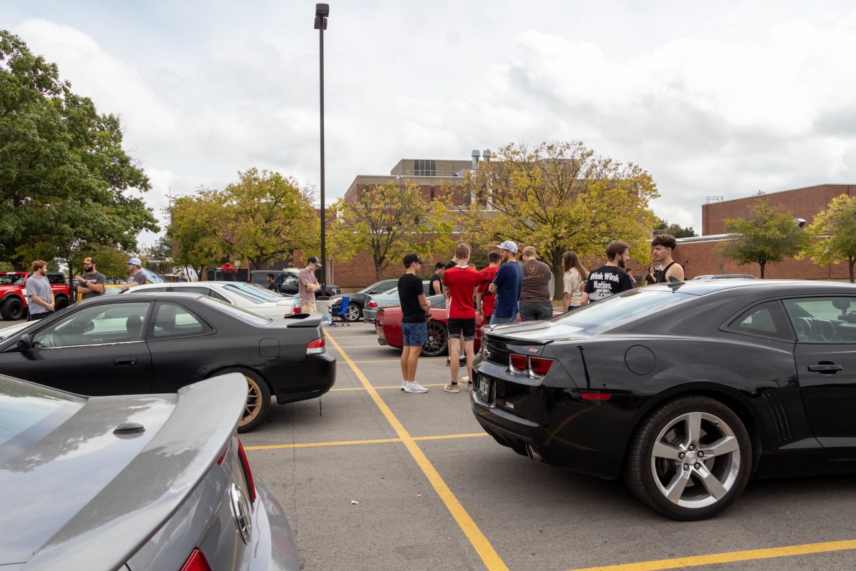 Spectators and showcasers chat at the ISU Car Club Car Show, Ames, Iowa, Sept. 14, 2024