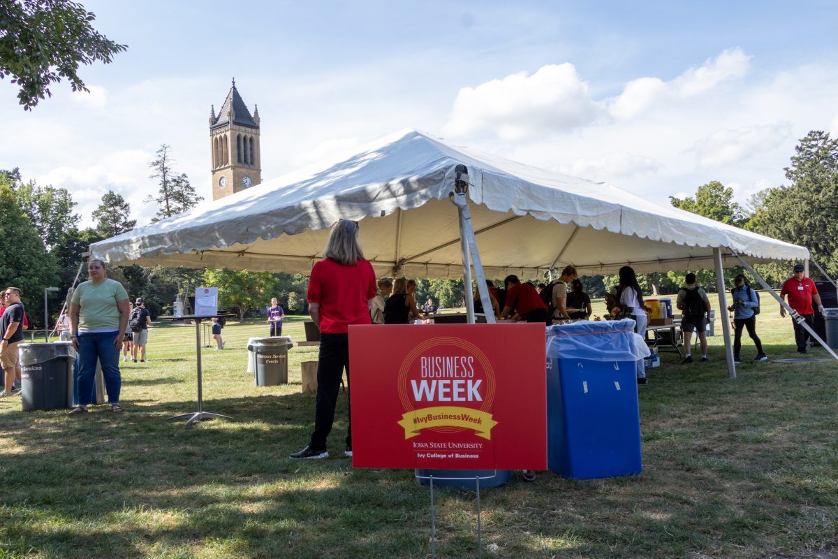 A sign in front of a food tent in central campus welcomes students and staff to the first event of Business Week, Sept. 16, 2024, Ames, Iowa.