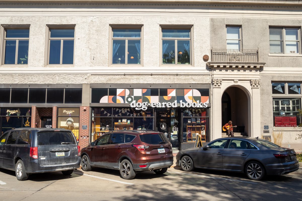 Local Musician, Avery Oppermam practicing guitar outside of Dog-Eared Books, September 26th 2024