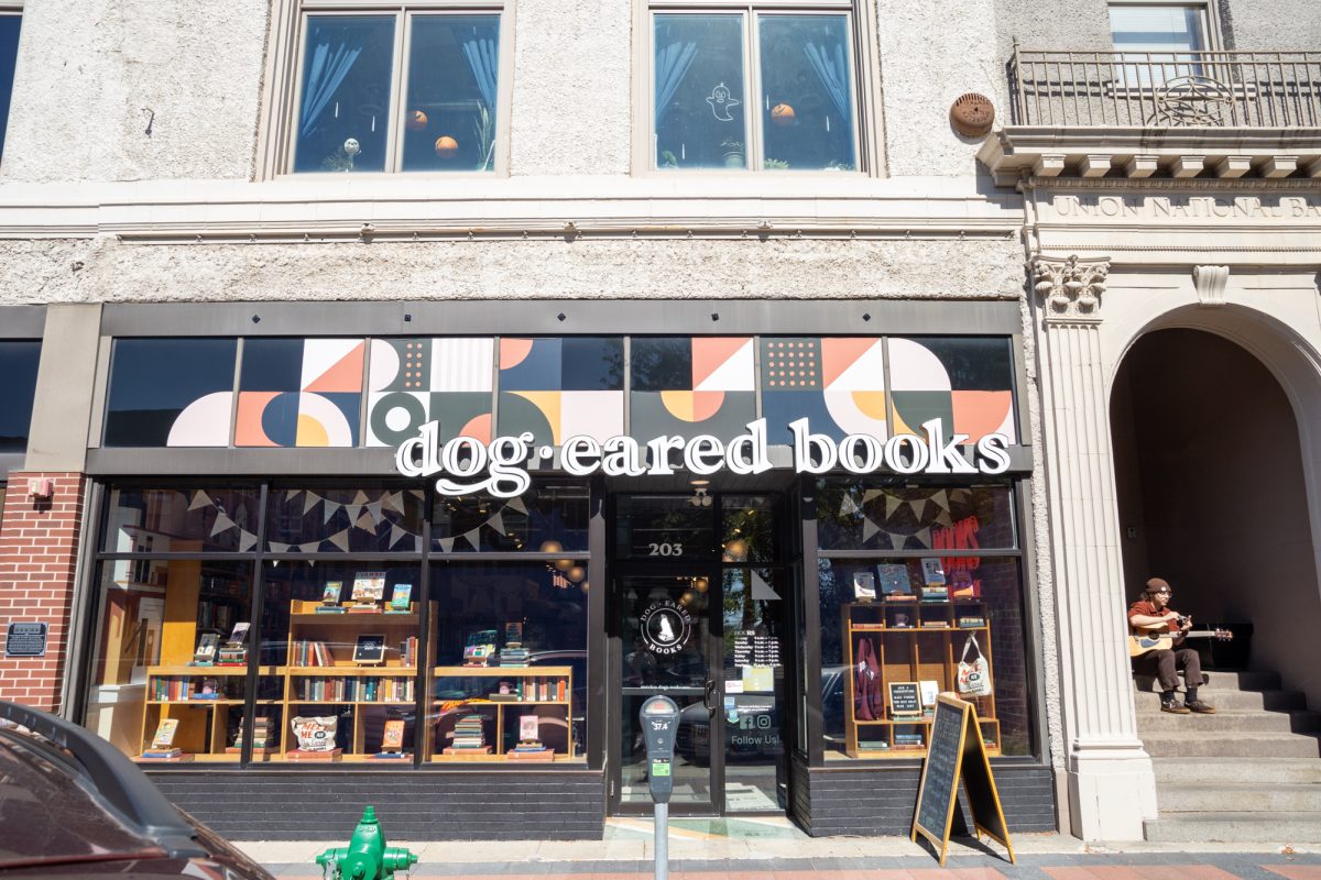 Local Musician, Avery Oppermam practicing guitar outside of Dog-Eared Books, September 26th 2024