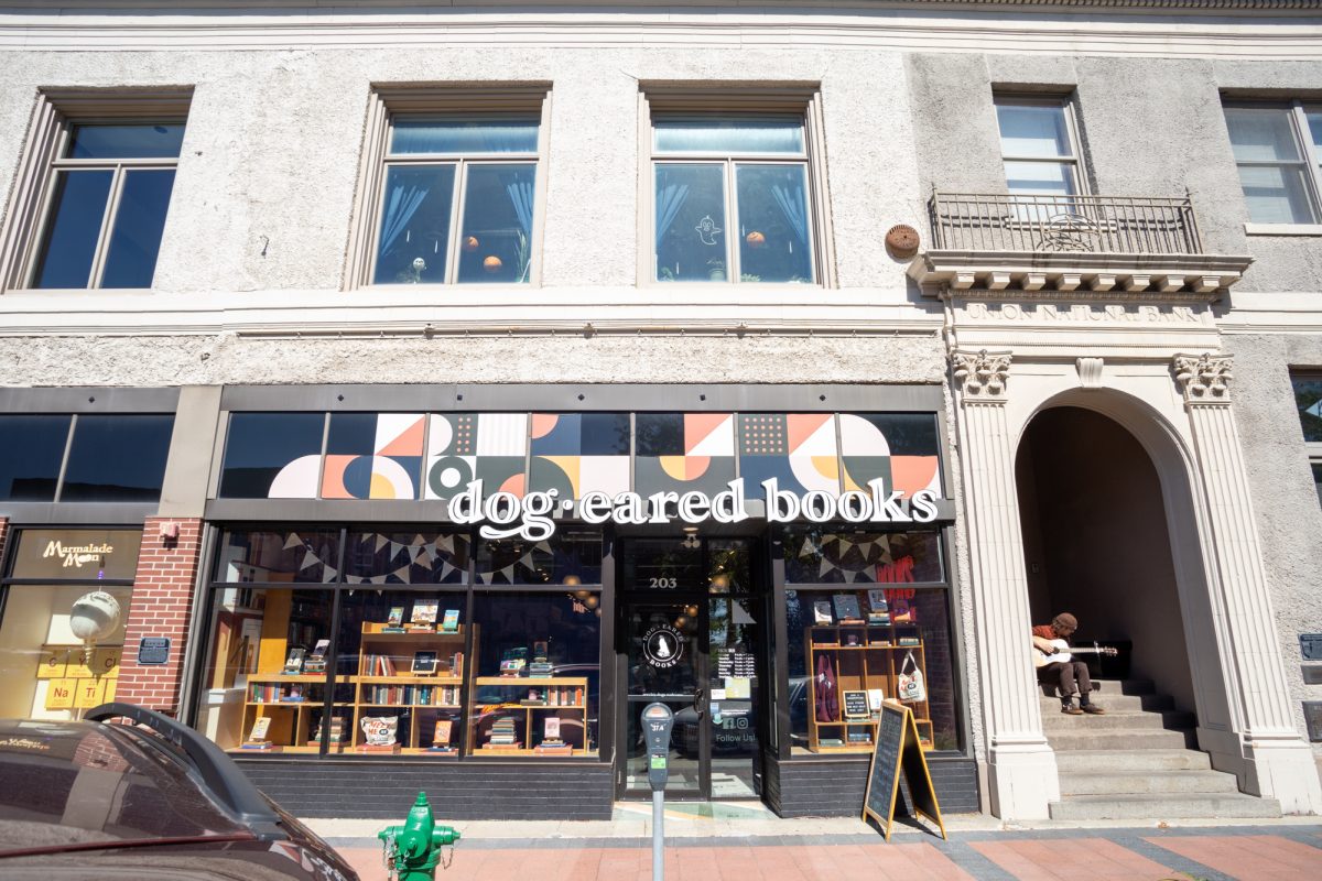 Local Musician, Avery Oppermam practicing guitar outside of Dog-Eared Books, September 26th 2024