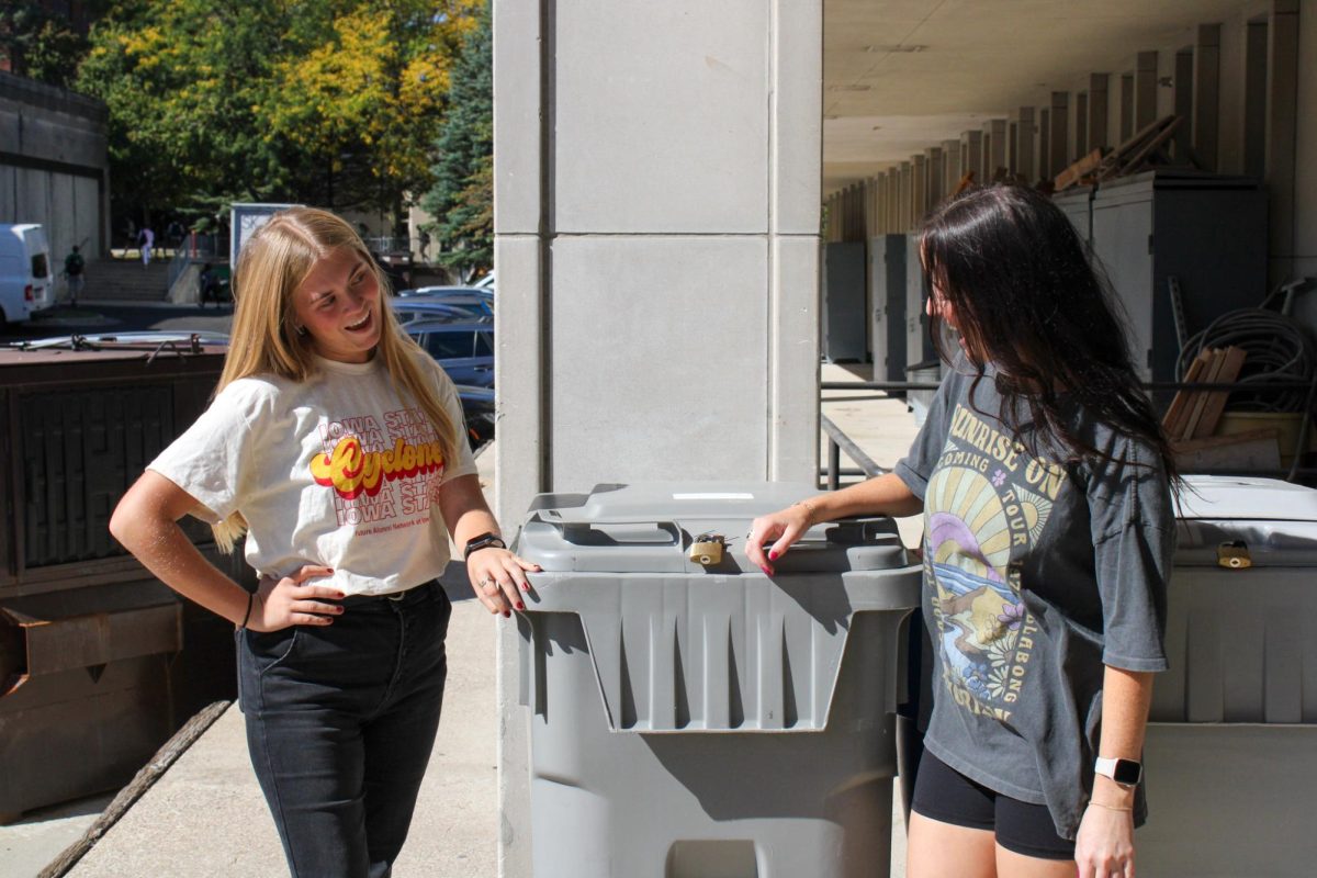 Mackenzy Ruff and Gabby Mowbray who are apart of Sweep The Streets posing by a trash can on Sept 30, 2024.