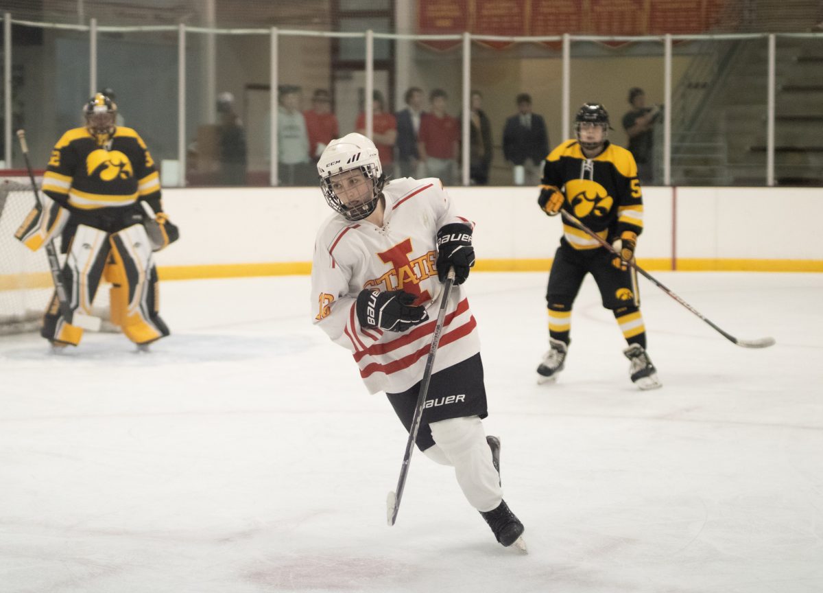 Iowa State's women's hockey club player number 12 skating to catch up to the puck versus the University of Iowa women's hockey club at the ISU Ice Arena, Sept. 27, 2024.