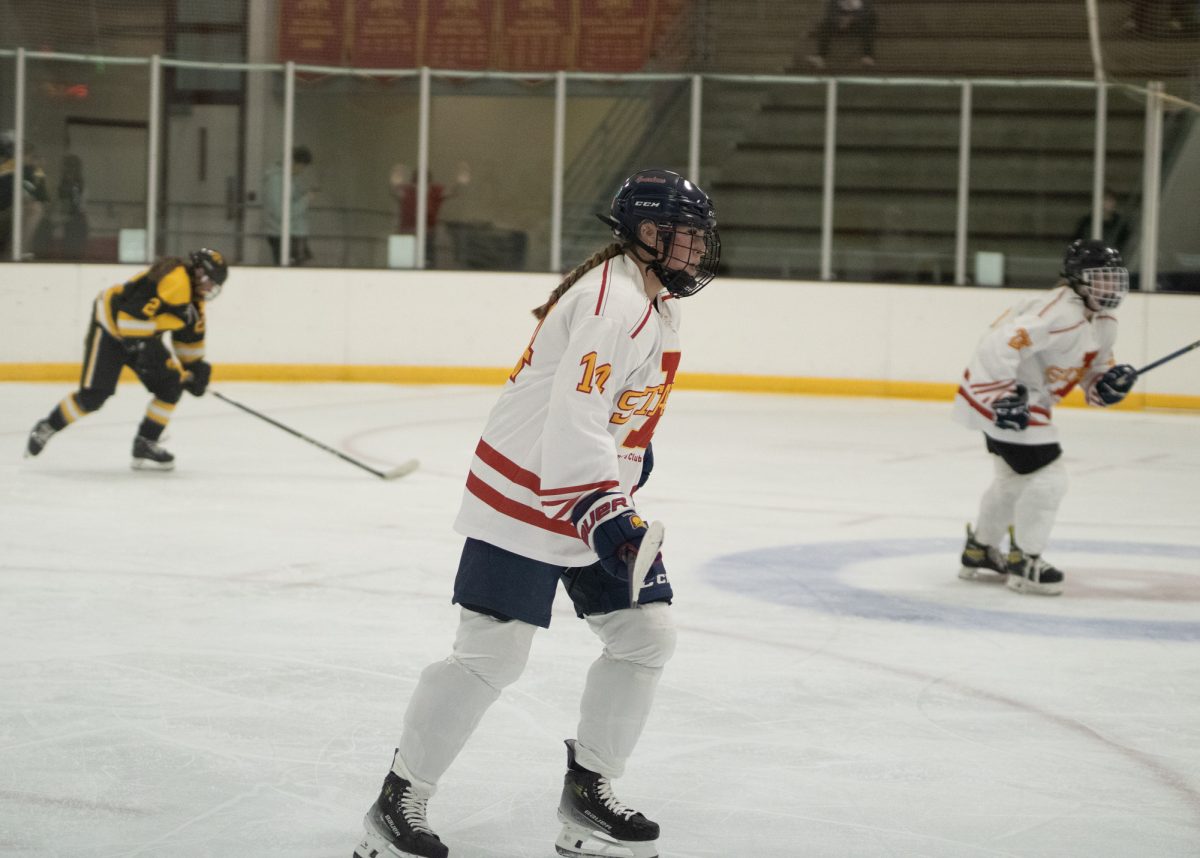 Iowa State's women's hockey club player number 14 waiting to play defense versus the University of Iowa women's hockey club at the ISU Ice Arena, Sept. 27, 2024.