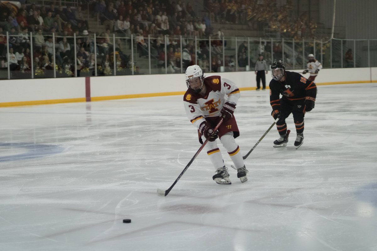 Iowa State's men's hockey club player number 3 chasing the puck versus University of Jamestown men's hockey team at the ISU Ice Arena, Sept. 27, 2024. 