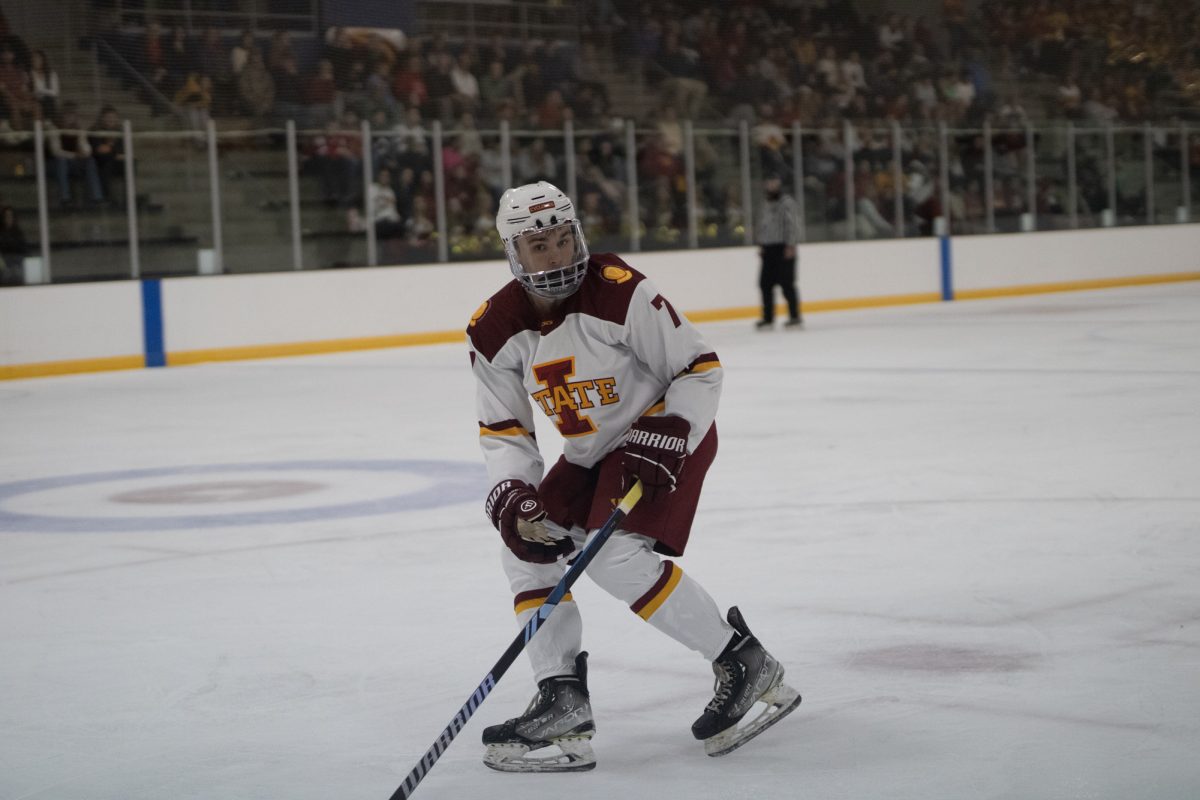 Iowa State's men's hockey club player Riley Kress (7) skating to the puck versus University of Jamestown men's hockey team at the ISU Ice Arena, Sept. 27, 2024. 