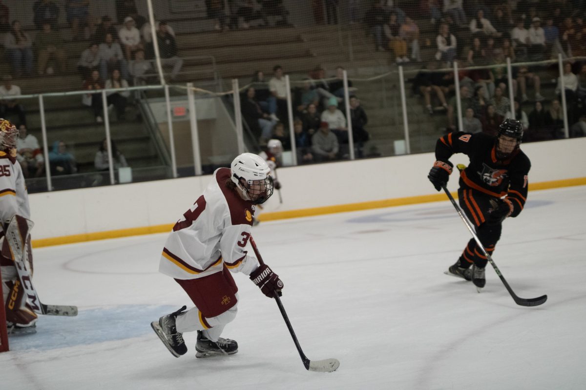 Iowa States men's hockey club player (3) keeping the puck under control to pass versus University of Jamestown men's hockey team at the ISU Ice Arena, Sept. 27, 2024. 