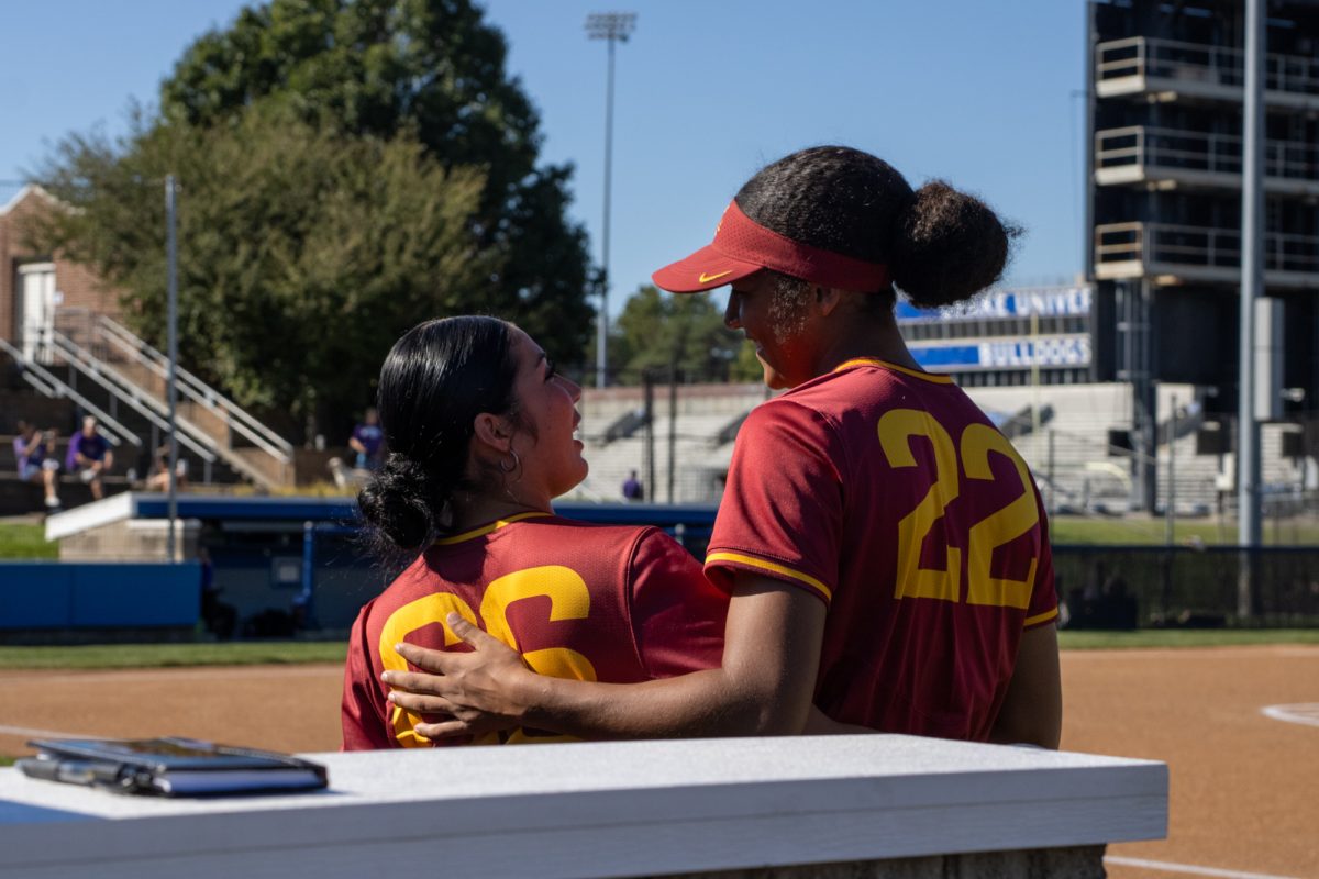 Iowa State's right hand pitcher Tatum Johnson (22) hugs Iowa State's left hand pitcher Aziza Rodriguez (66) during warmups versus University of Northern Iowa softball game During the Big 4 classic, at Buel Field, Drake University, Des Moines, Iowa, on Sept. 29, 2024.  