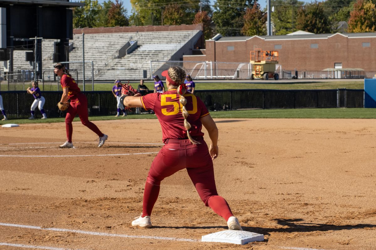 Iowa State's softball team's first baseman Ashley Minor (50) stretches to catch a ball during infield warmups versus University of Northern Iowa softball game During the Big 4 classic, at Buel Field, Drake University, Des Moines, Iowa, on Sept. 29, 2024.  