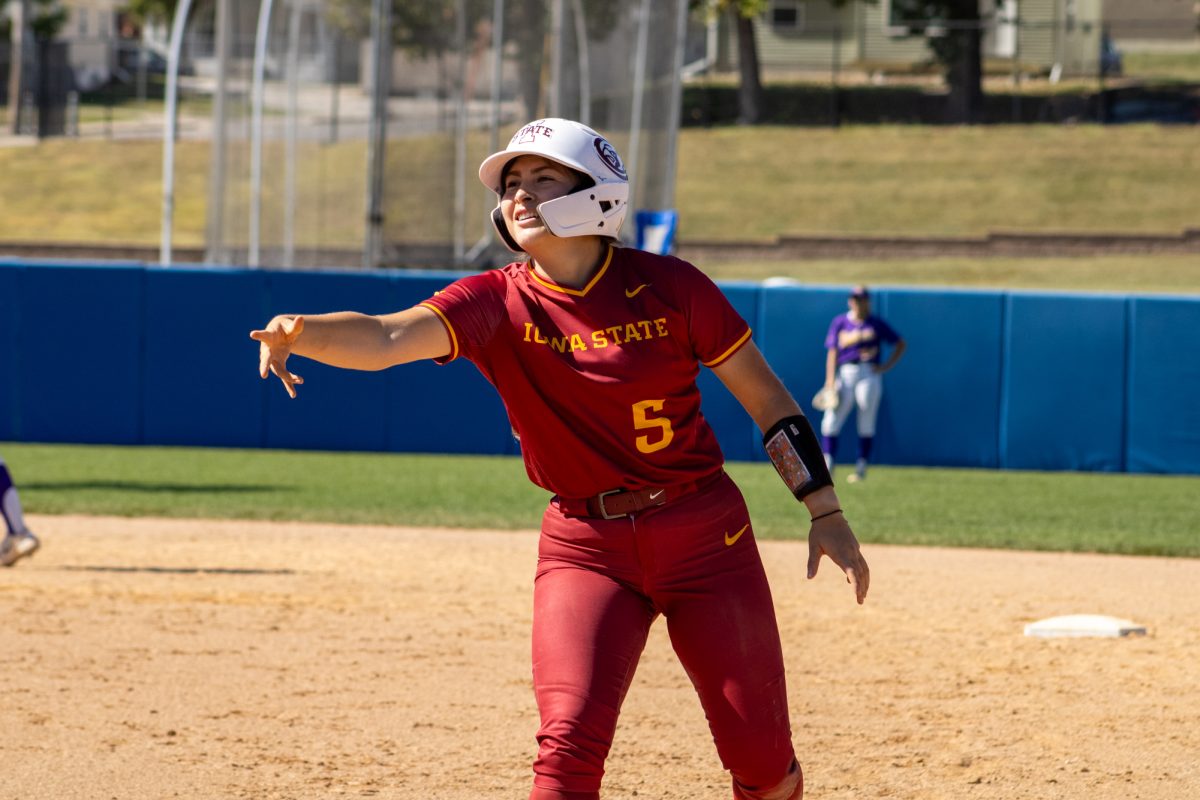 Iowa State's softball team's Angelita Fuentes (5) throws elbow to the dugout guard versus University of Northern Iowa softball game During the Big 4 classic, at Buel Field, Drake University, Des Moines, Iowa, on Sept. 29, 2024.  