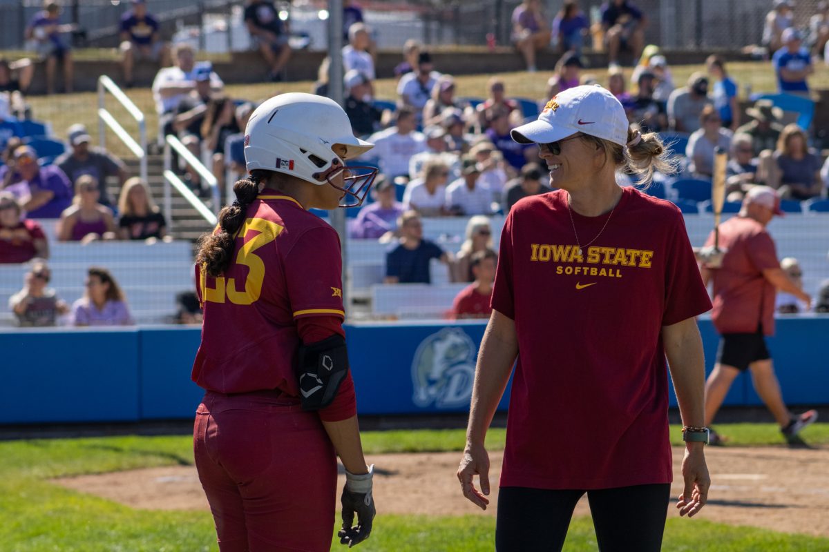 Iowa State's softball team's Angelina Allen (23) and assistant coach Lindsey Ubrun talk between innings versus University of Northern Iowa softball game During the Big 4 classic, at Buel Field, Drake University, Des Moines, Iowa, on Sept. 29, 2024.  