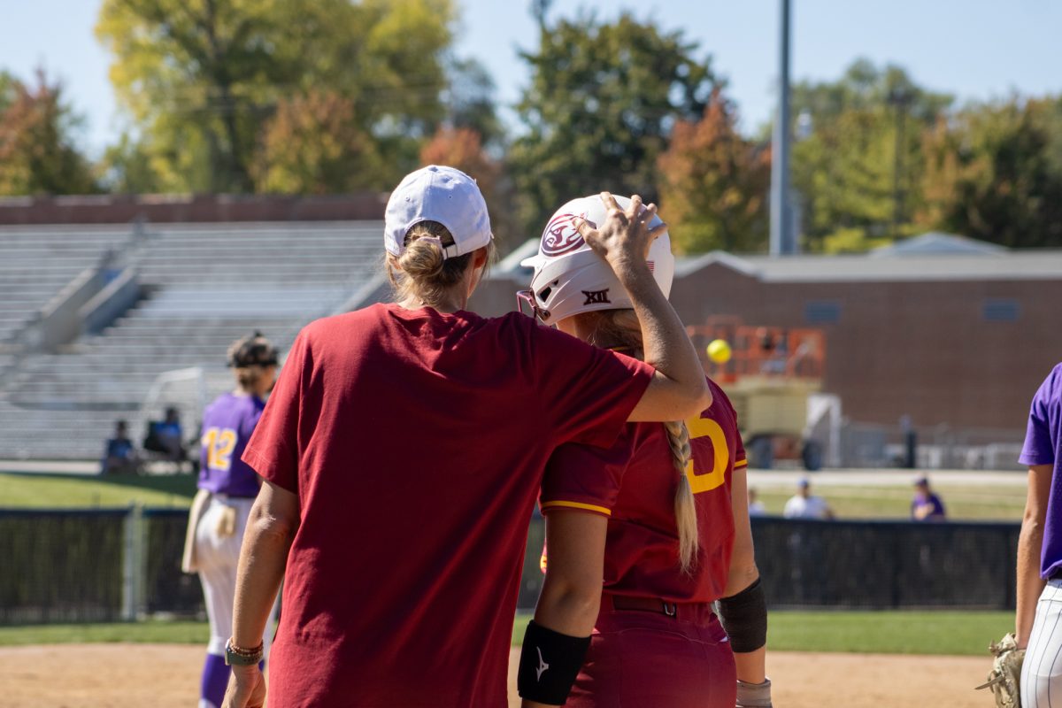 Iowa State's softball team's assistant coach Lindsey Ubrun congratulating player Ireland Buss (3) versus University of Northern Iowa softball game During the Big 4 classic, at Buel Field, Drake University, Des Moines, Iowa, on Sept. 29, 2024.  