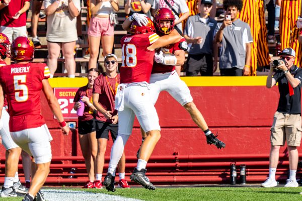 Jack Bjorn (48) hugs his teammate after a touchdown during the Iowa State football game vs Arkansas State at Jack Trice Stadium on Sept. 21, 2024.