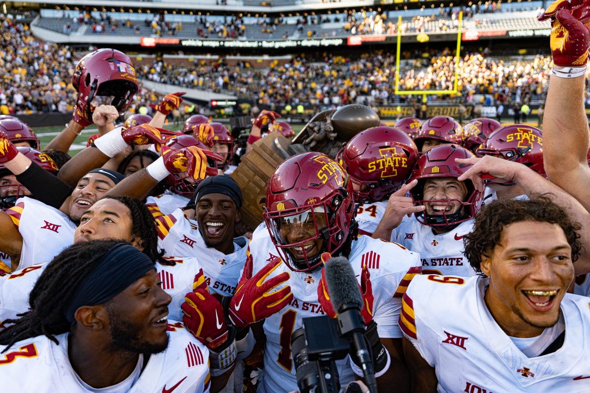 Iowa State holds up the Cy-Hawk trophy after a victory over the University of Iowa, Sept. 7, 2024, Kinnick Stadium.