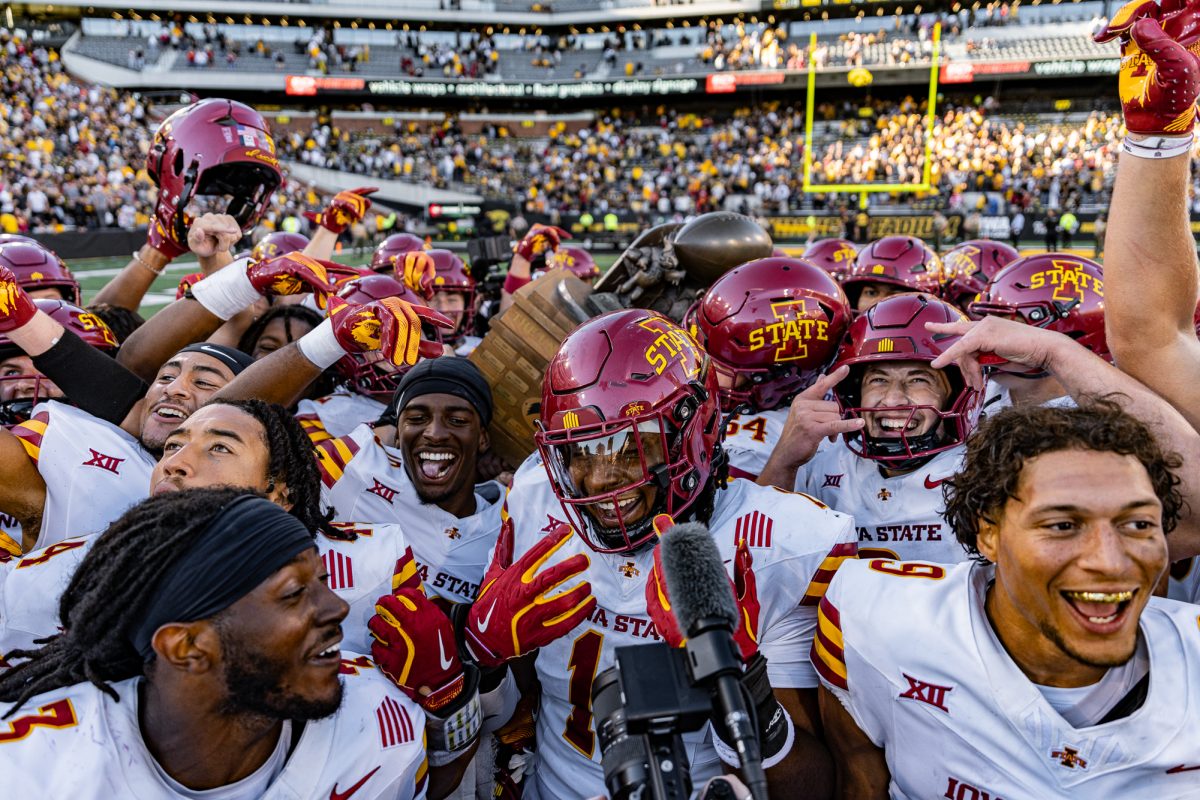 Iowa State holding up the Cy-Hawk trophy after a victory over the University of Iowa, Sept. 7, 2024, Kinnick Stadium.