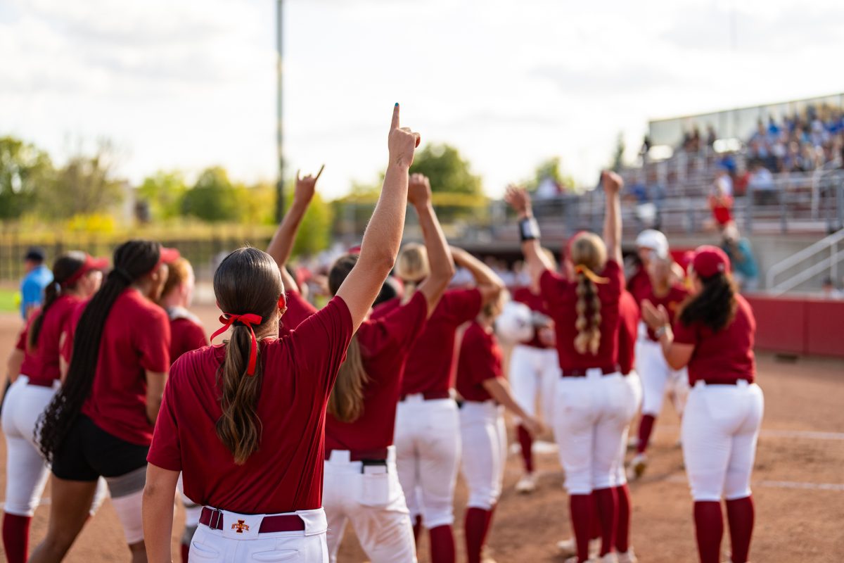 Iowa State players hold their hands to the sky after a home run against DMACC at the Cyclone Sports Complex, Sept. 18, 2024.