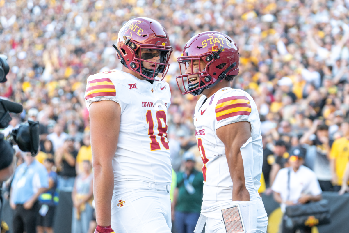 Jayden Higgins (9) and Benjamin Brahmer (18) celebrate a Higgins touchdown during the Cy-Hawk game against Iowa at Kinnick Stadium in Iowa City, Iowa on Sept. 7, 2024. 