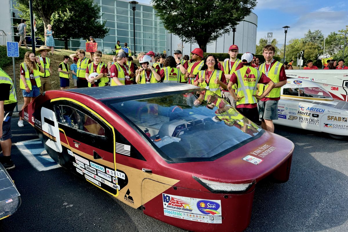 Team PrISUm stands around their solar car waiting to move to the starting line, July, 20, 2024, Nashville, TN.