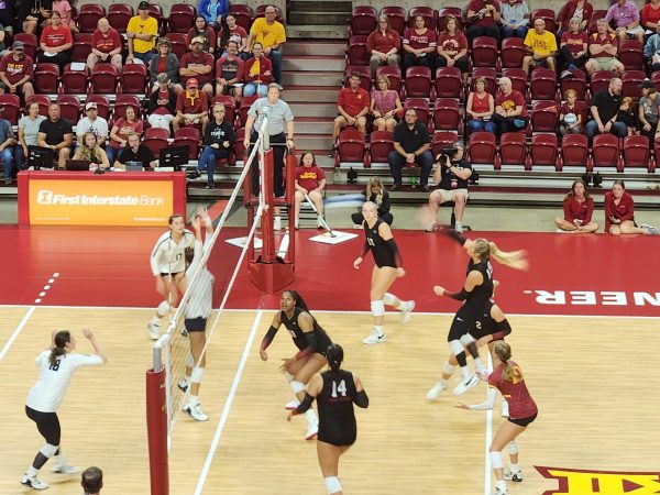 Faith DeRonde (No. 19) spikes the ball over the net during Iowa State's win over Toledo in the Cyclone Invitational on Sept. 6, 2024.