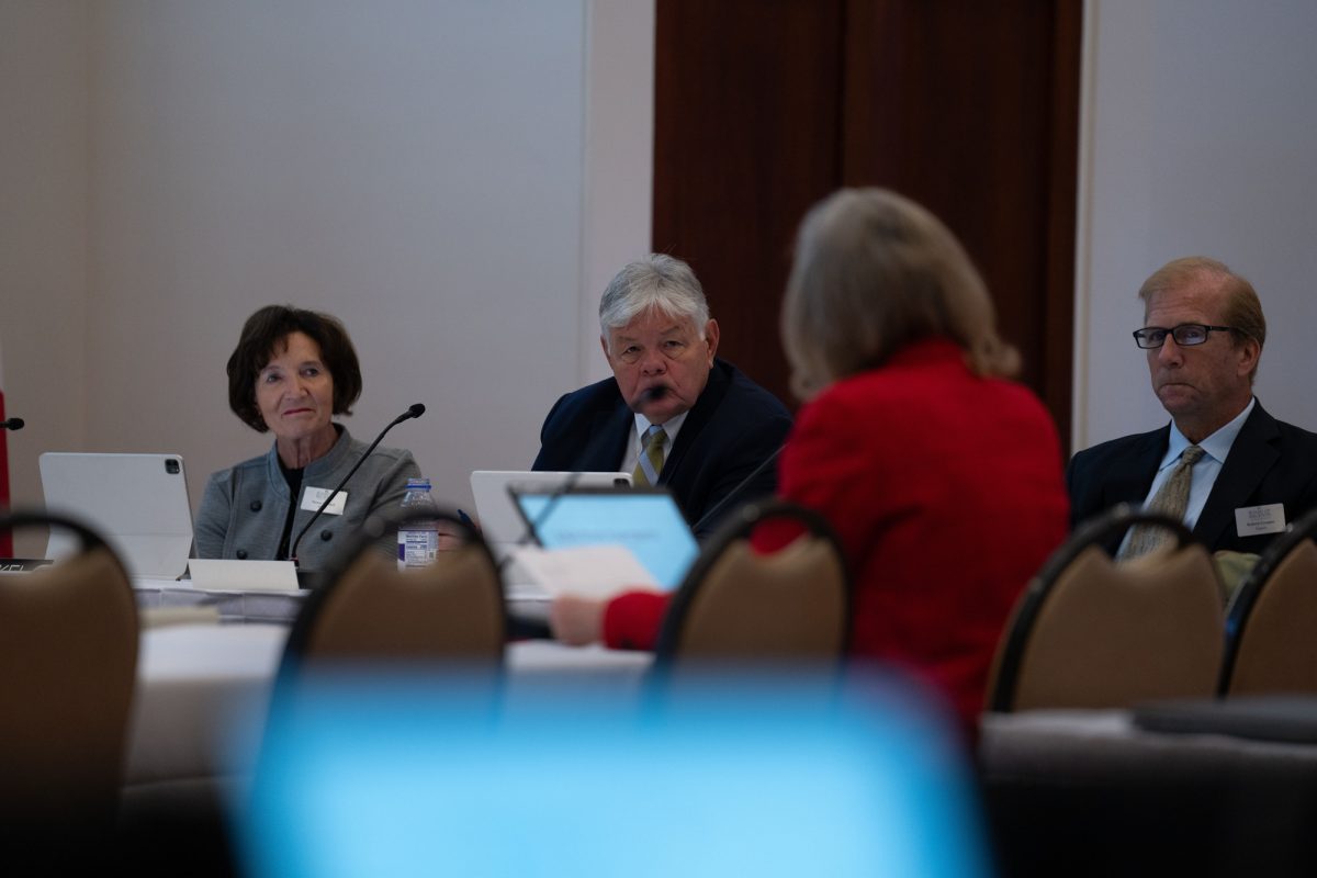 Regents Nancy Dunkel (left), Jim Lindenmayer (center) and Robert Cramer (right) watch Iowa State President Wendy Wintersteen speak during an Iowa Board of Regents meeting at the Alumni Center on Sept. 19, 2024. 