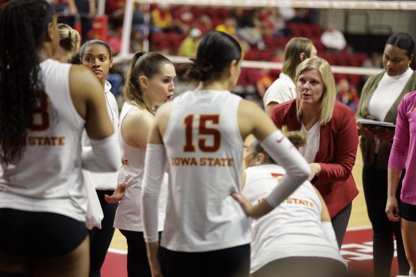 Christy Johnson-Lynch talks to her players during a time out at the Iowa State vs. Brigham Young University volleyball game at Hilton Coliseum Oct.16, 2024.  