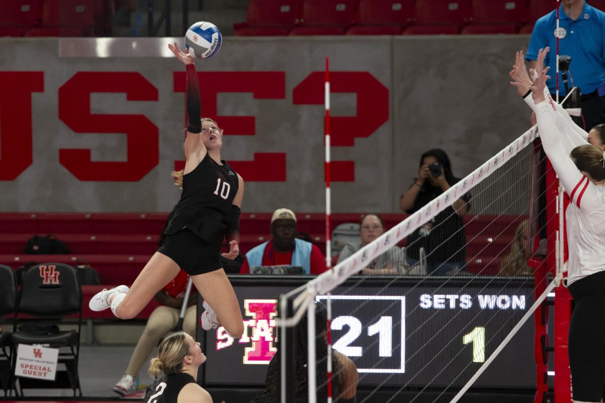 Iowa State's Rachel Van Gorp (10) leaps into the air to spike the ball during the second half of an NCAA women's college volleyball match, Wednesday, Oct. 9, 2024 in Houston, Texas. Photo by Raphael Fernandez/The Cougar