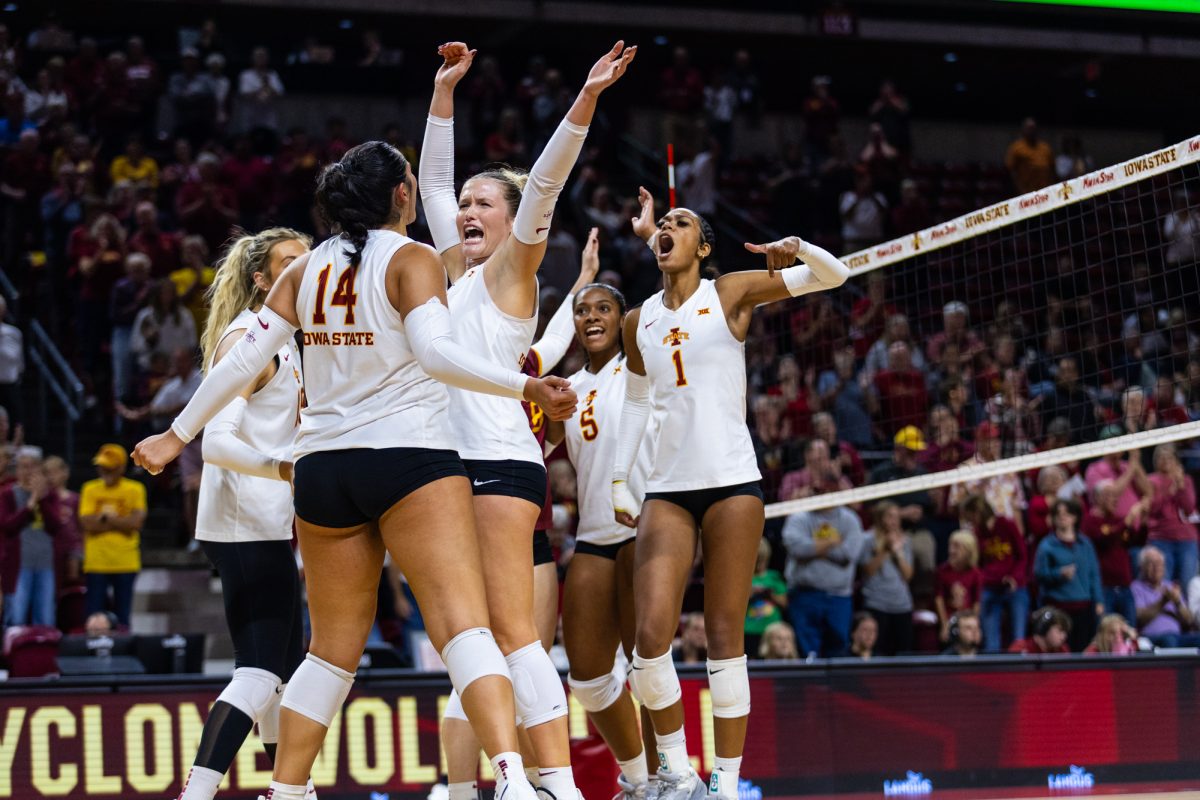 The Iowa State volleyball team celebrates during the Cincinnati volleyball game at Hilton Coliseum on Oct. 2, 2024.