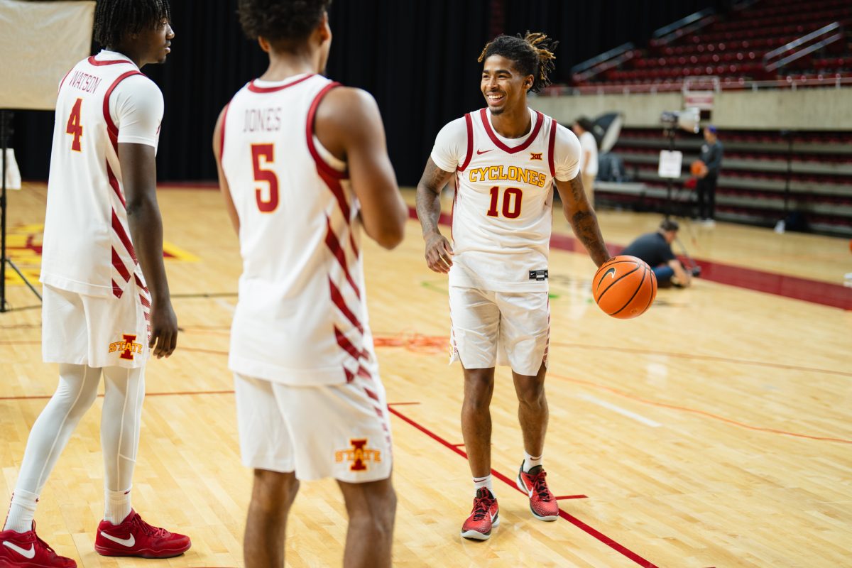 Keshon Gilbert (10) interacts with teammates Demarion Watson (4) and Curtis Jones (5) during the Iowa State men's basketball media day, Hilton Coliseum, Oct. 9, 2024.