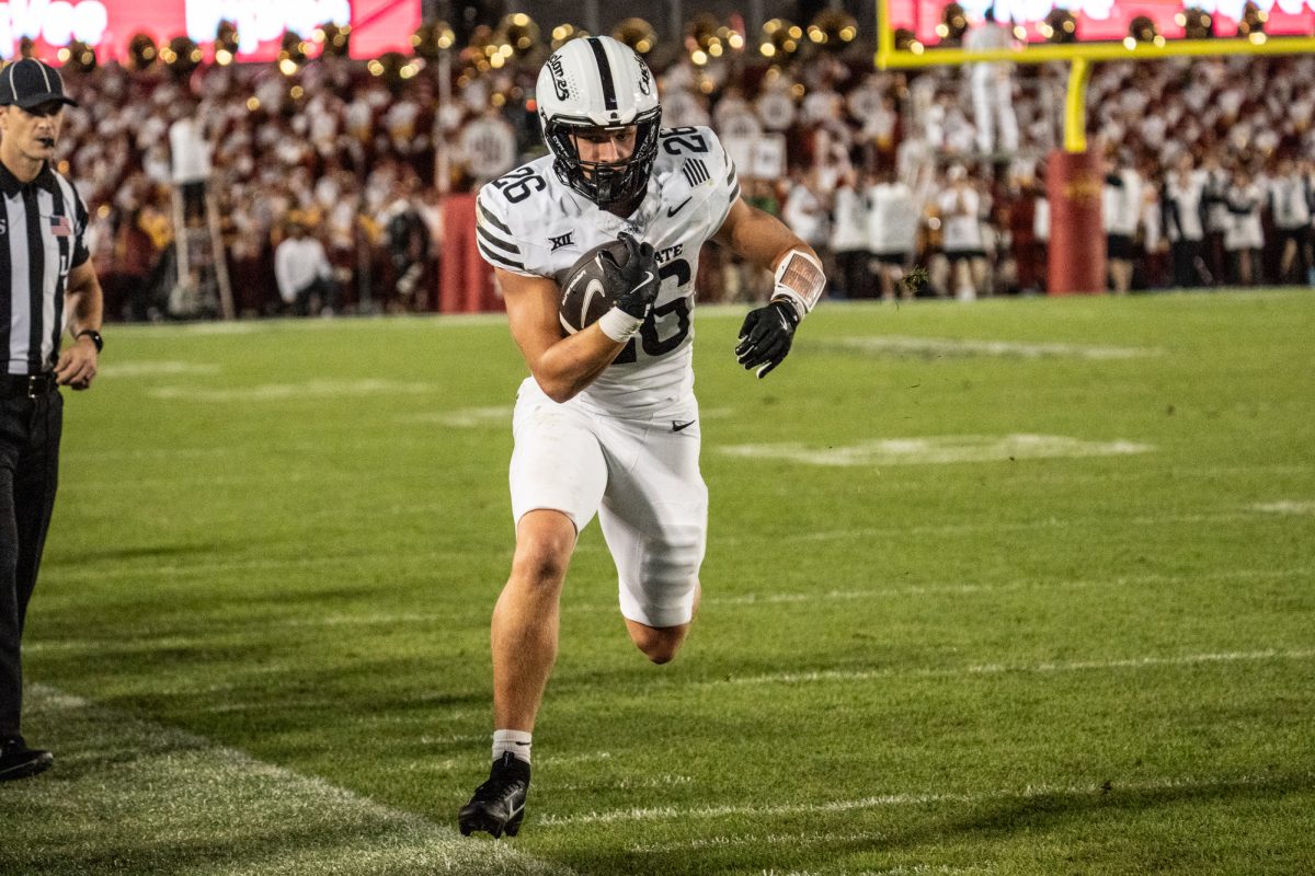 Carson Hansen (26) runs the ball during the Iowa State vs. Baylor football game at Jack Trice Stadium on Oct. 5, 2024.