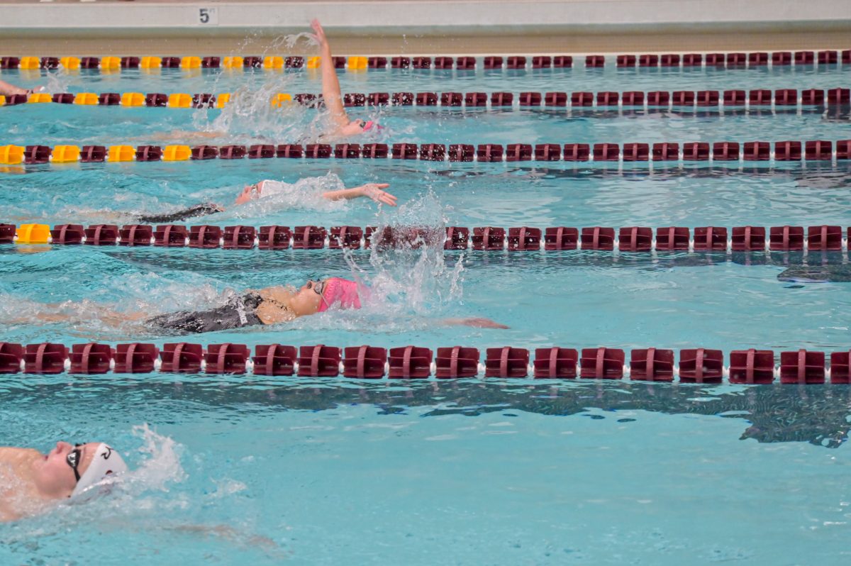 Iowa State Lili Neisser leads her heat in the 200m backstroke against the visiting South Dakota swimmers, Oct. 18, 2024.