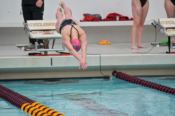 Iowa State swimmer Mallory Miller takes off the starting block for the 200m breaststroke in lane one against the visiting South Dakota at Beyer Hall, getting fourth in her event, Oct. 18, 2024.