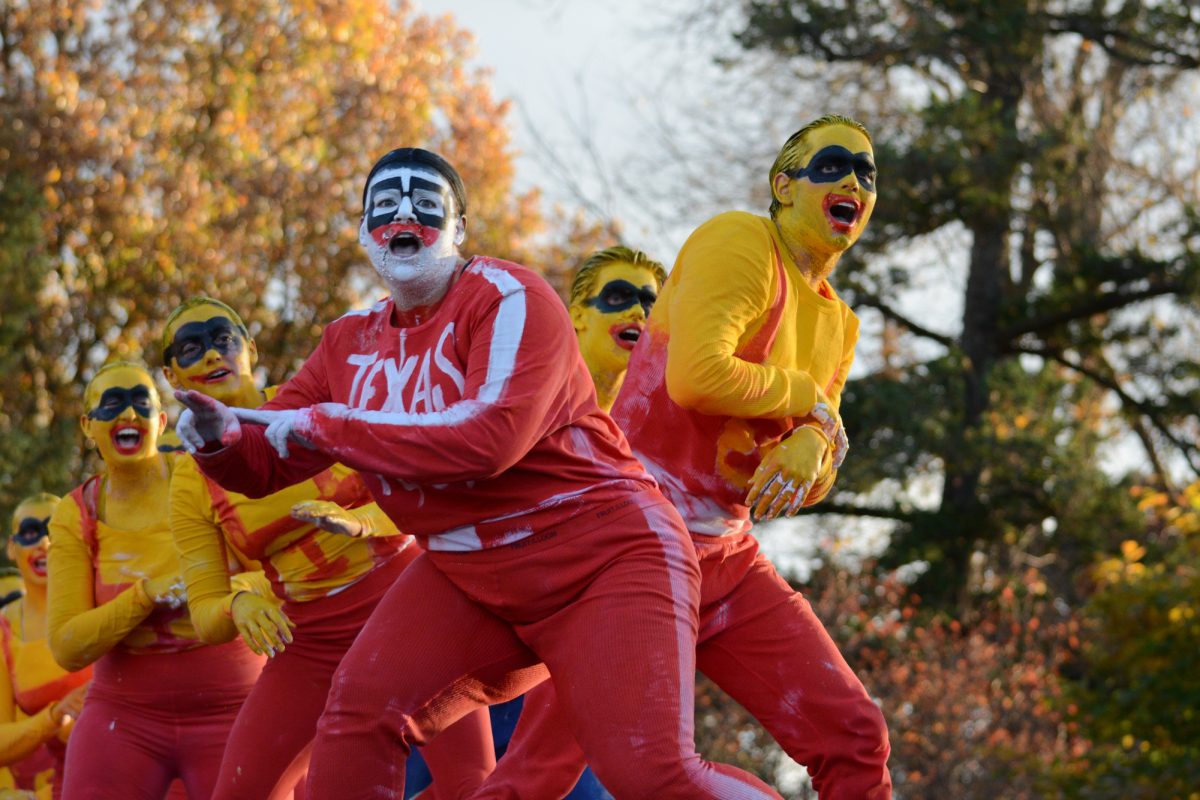 Members of the Yell Like Hell group "Despicable Cy" perform onstage during the Yell Like Hell second cuts, Iowa State University, Ames, Iowa, Oct. 31, 2024.