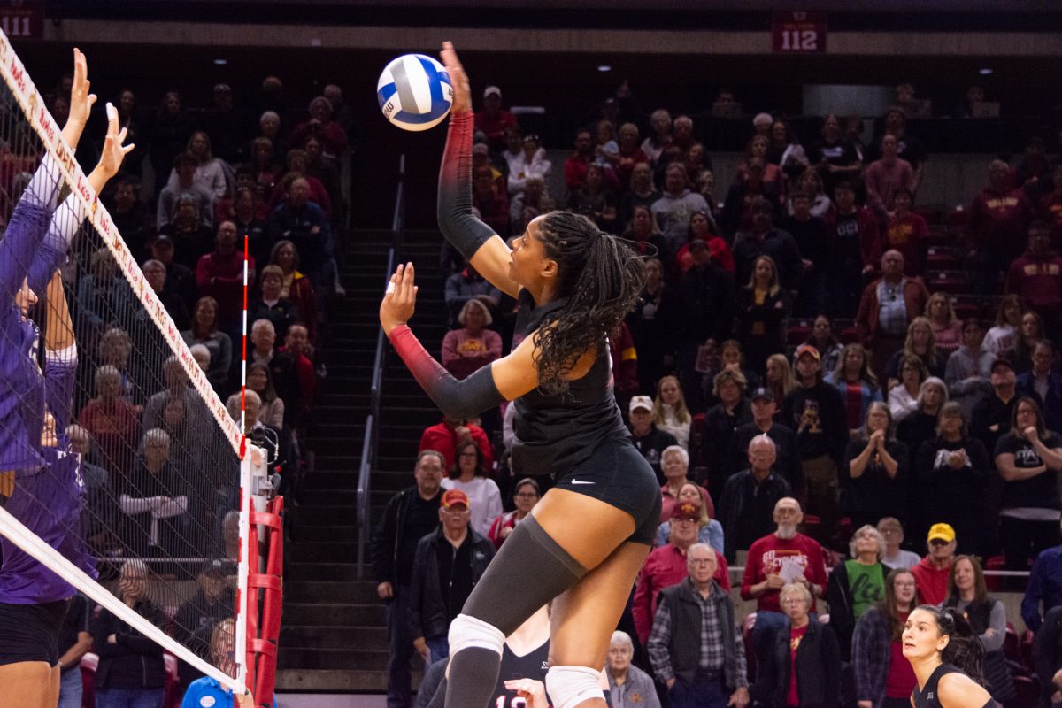 Amiree Hendricks-Walker (18) spikes the ball during the game vs. Kansas State University,Hilton Colosseum, Ames, Iowa, Oct. 27, 2024.