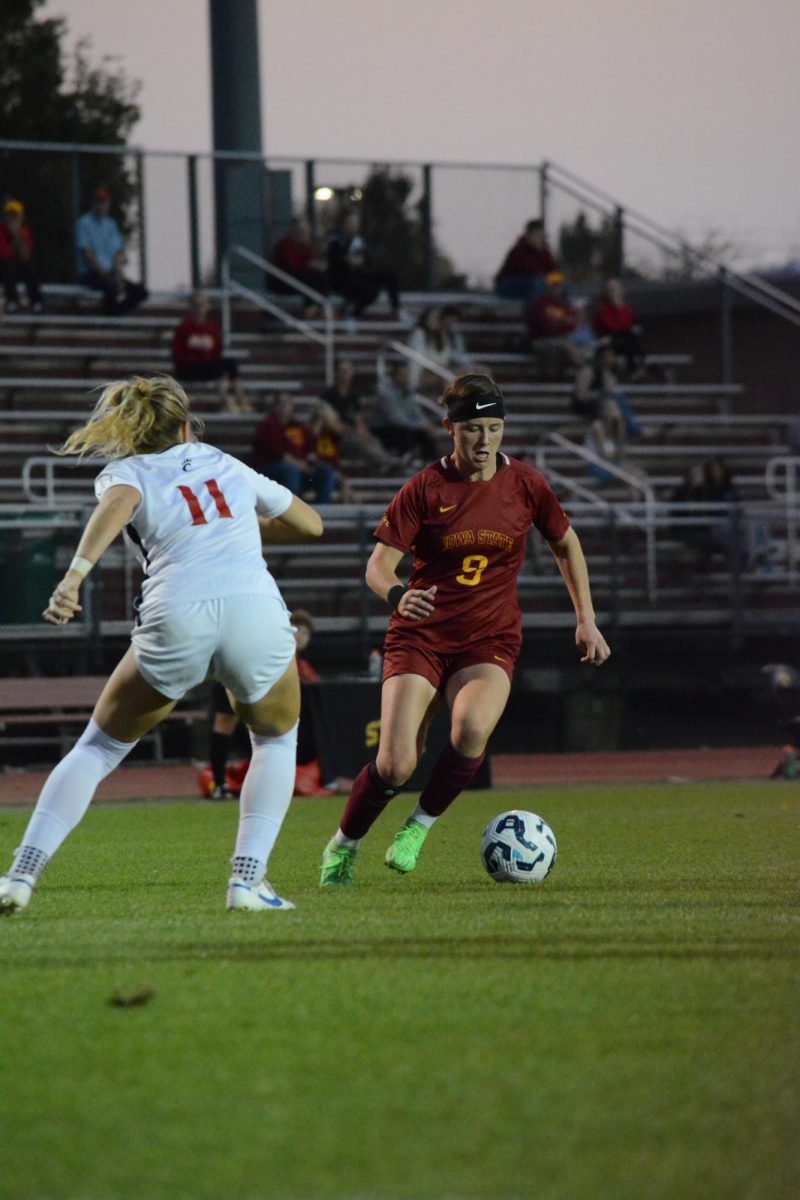 Lauren McConnell (9) kicks the ball around Faith Broering (11) of Cincinnati during the game versus Cincinnati, Cyclone Sports Complex, Ames, Iowa, Oct. 10, 2024.