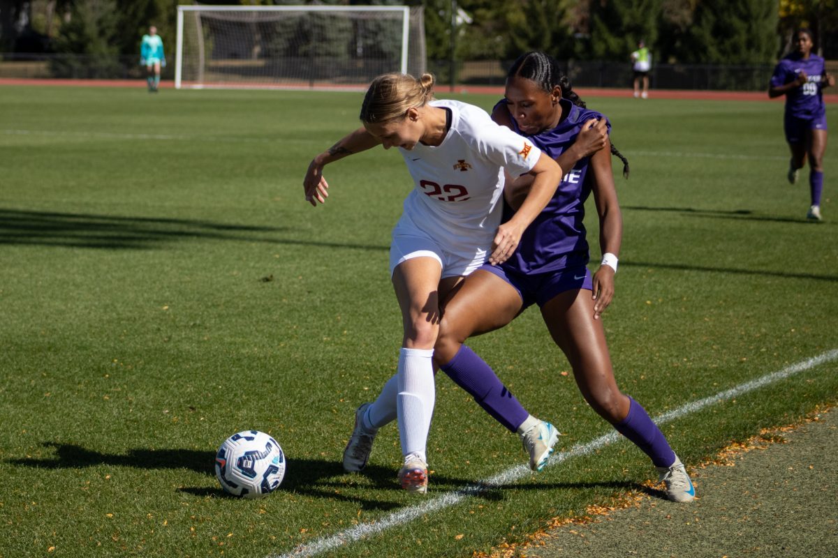 Iowa State's women's soccer player Adelaide Wolfe (22) blocking a K-State player from getting the ball versus K-State at Cyclone Sports Complex, Oct. 6, 2024. 