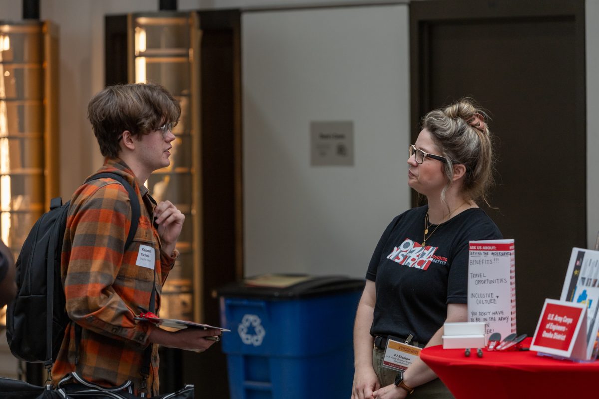 Kenny Tschida (Left), a Junior in Graphic Design, talks with PJ Stanton (Right) about employment opportunities with the US Army Corps of Engineers. October 3rd, 2024