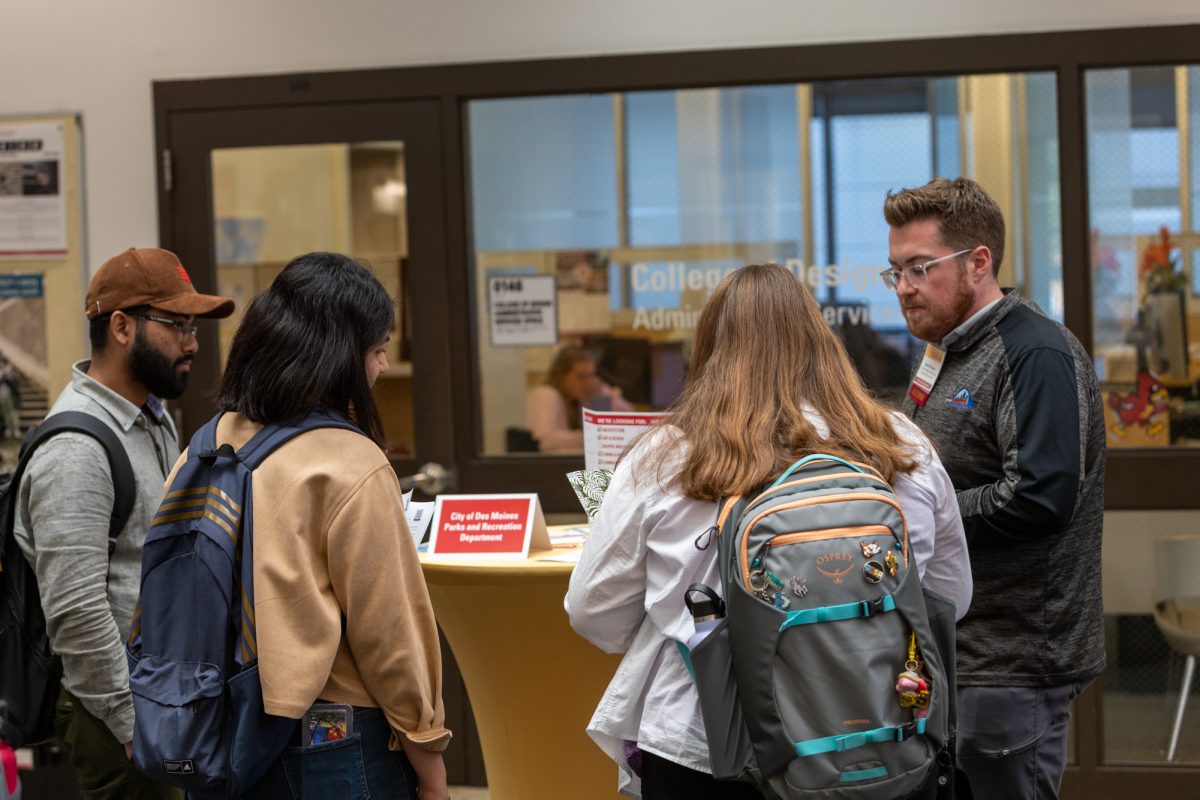 Ovi, a freshman archeticture  (Left) and Marzieh Janbazi (Middle) talk to Derek Hansen (Right) about job opportunities at City of Des Moines Parks and Recreation Department. October 3rd, 2024 