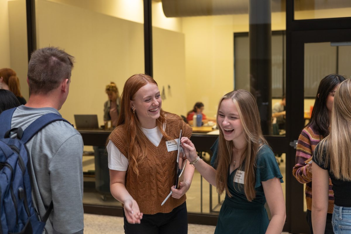 Ava Eisenbarth (Left), a Junior in Architecture and Rachel Koster (Right), Junior in Architecture share a joke while waiting to talk to employers. October 3rd, 2024