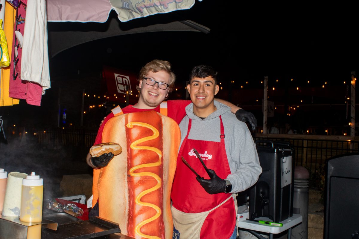 Superdog dudes Brant Gicante (Left) and Bryan Carapia (Right) giving out smiles while selling hotdogs in Ames, stated by one of there customers. Welch Avenue, Ames IA, Oct 31st, 2024