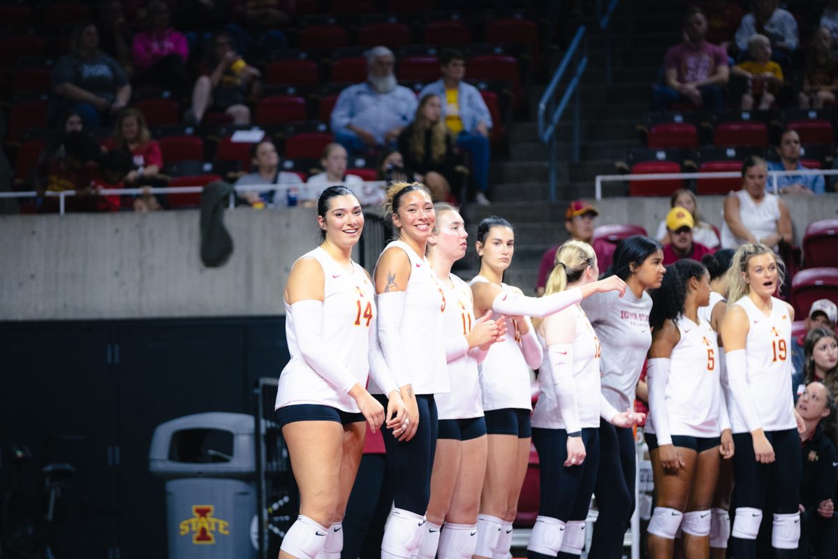 Nayelii Gonzalez (14) and Tierney Jackson (3) smile at the camera during the Iowa State vs Cincinnati volleyball game at Hilton Coliseum on Oct. 2, 2024.