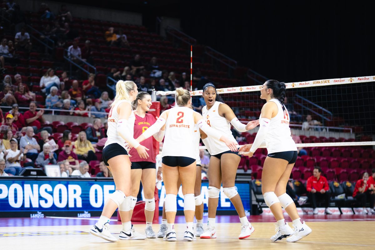 The Iowa State volleyball team celebrates during the Iowa State vs Cincinnati volleyball game at Hilton Coliseum on Oct. 2, 2024.