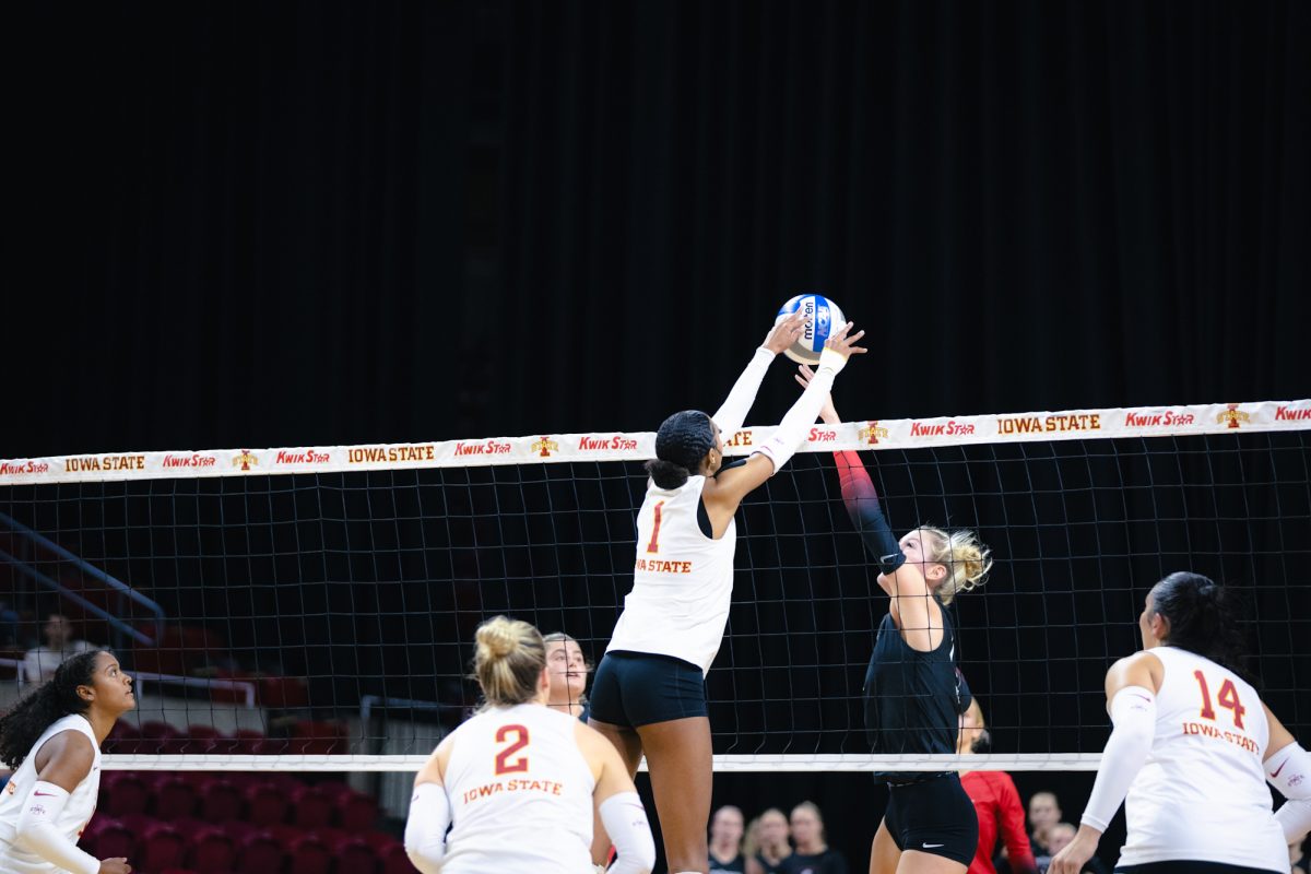 Pam McCune (1) goes up to block a ball during the Iowa State vs Cincinnati volleyball game at Hilton Coliseum on Oct. 2, 2024.