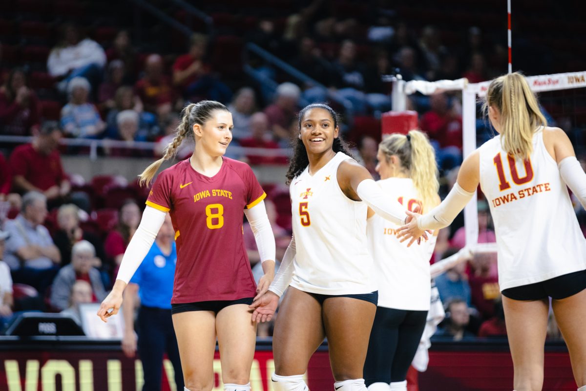 Maya Duckworth (5) and her team celebrate during the Iowa State vs Cincinnati volleyball game at Hilton Coliseum on Oct. 2, 2024.