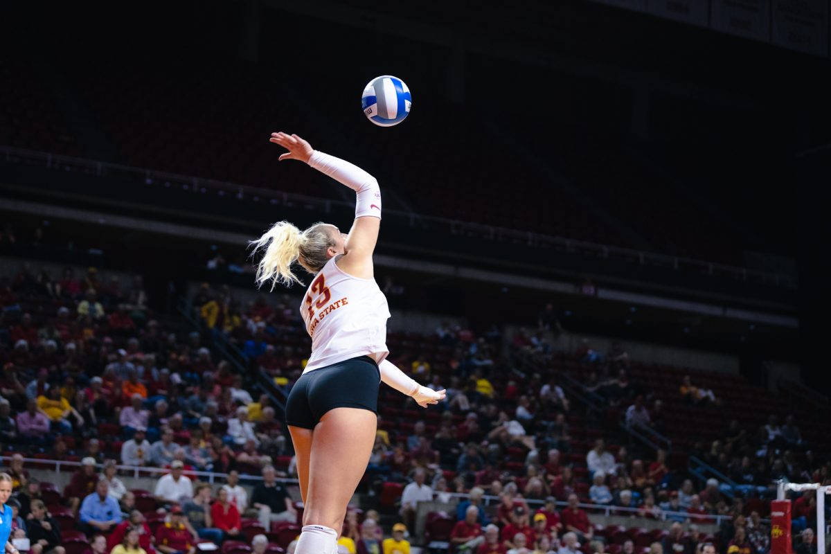 Lilly Wachholz (13) serves a ball during the Iowa State vs Cincinnati volleyball game at Hilton Coliseum on Oct. 2, 2024.