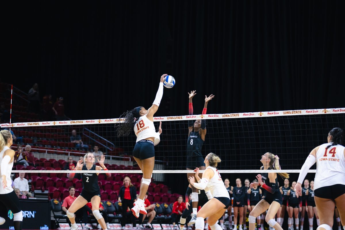 Amiree Hendricks-Walker (18) hits the ball during the Iowa State vs Cincinnati volleyball game at Hilton Coliseum on Oct. 2, 2024.