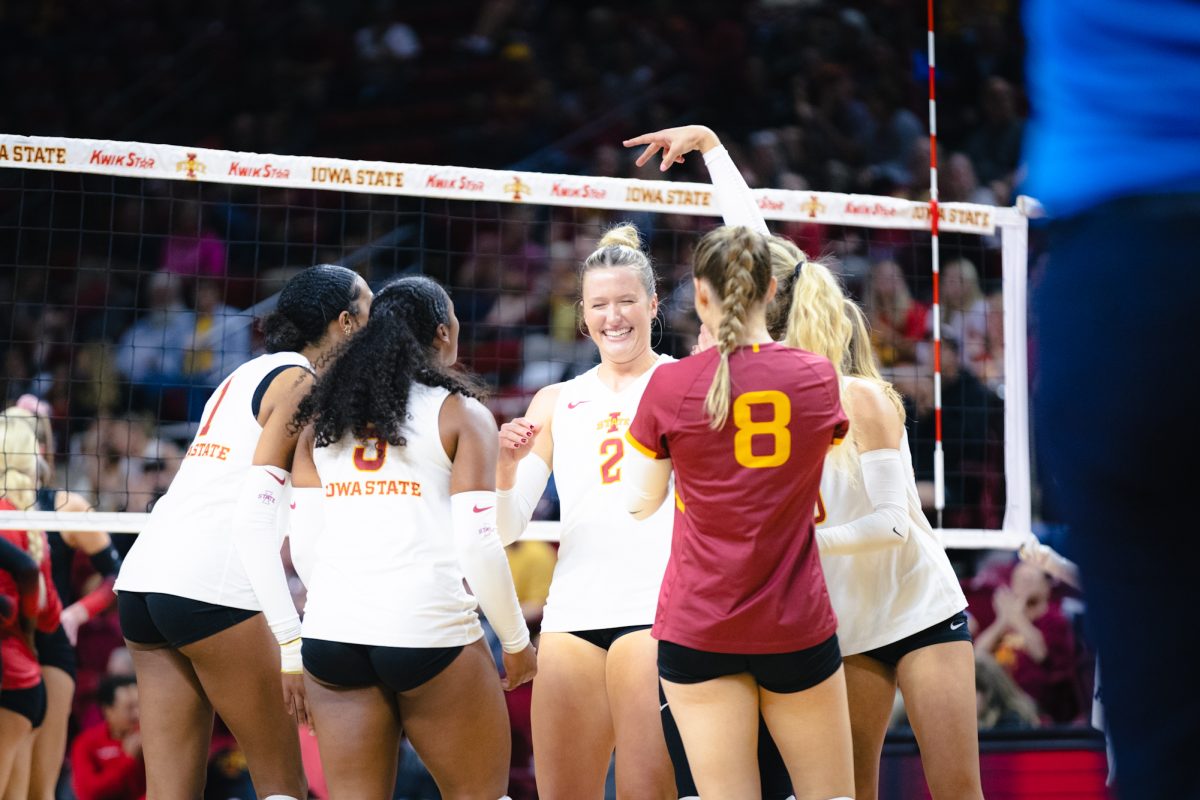 Morgan Brandt (2) and her team celebrate during the Iowa State vs Cincinnati volleyball game at Hilton Coliseum on Oct. 2, 2024.