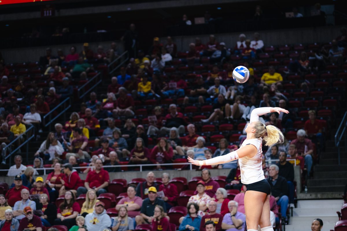 Lilly Wachholz (13) serves the ball during the Iowa State vs Cincinnati volleyball game at Hilton Coliseum on Oct. 2, 2024.