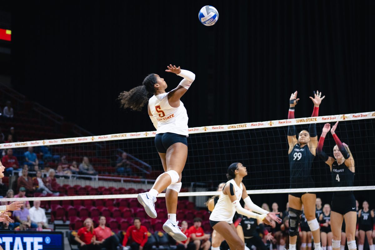 Maya Duckworth (5) goes up to hit the ball during the Iowa State vs Cincinnati volleyball game at Hilton Coliseum on Oct. 2, 2024.