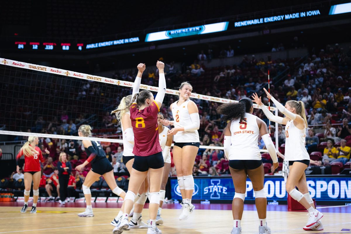 Morgan Brandt (2) and her team celebrate during the Iowa State vs Cincinnati volleyball game at Hilton Coliseum on Oct. 2, 2024.