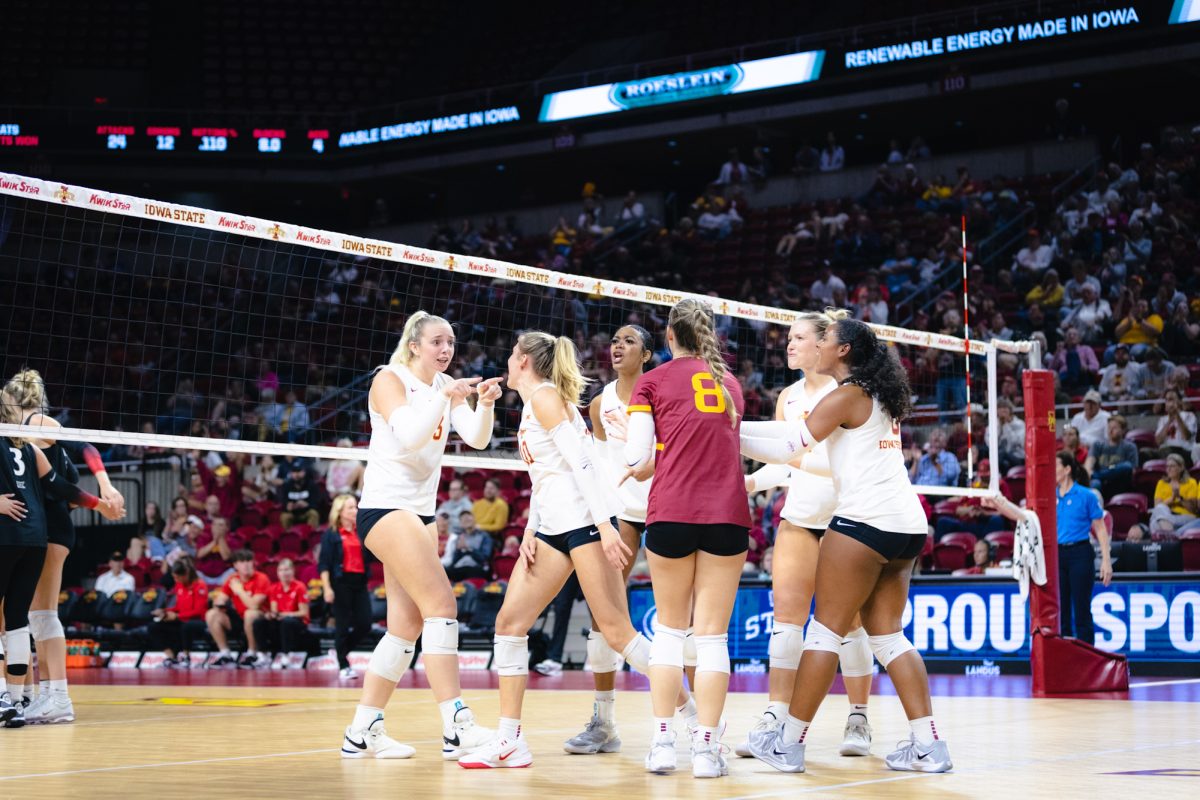 Lilly Wachholz (13) and her team celebrates a kill during the Iowa State vs Cincinnati volleyball game at Hilton Coliseum on Oct. 2, 2024.